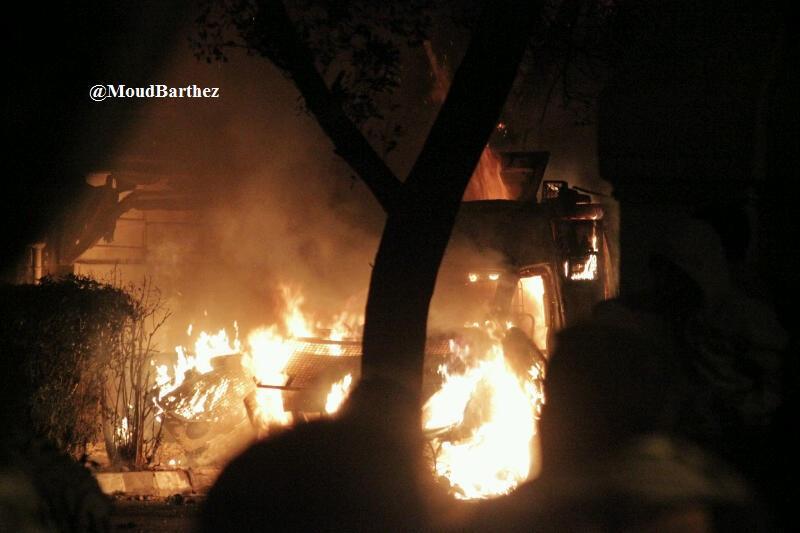 One of the two CSF APC trucks hijacked and torched by protesters [Credit in photo]