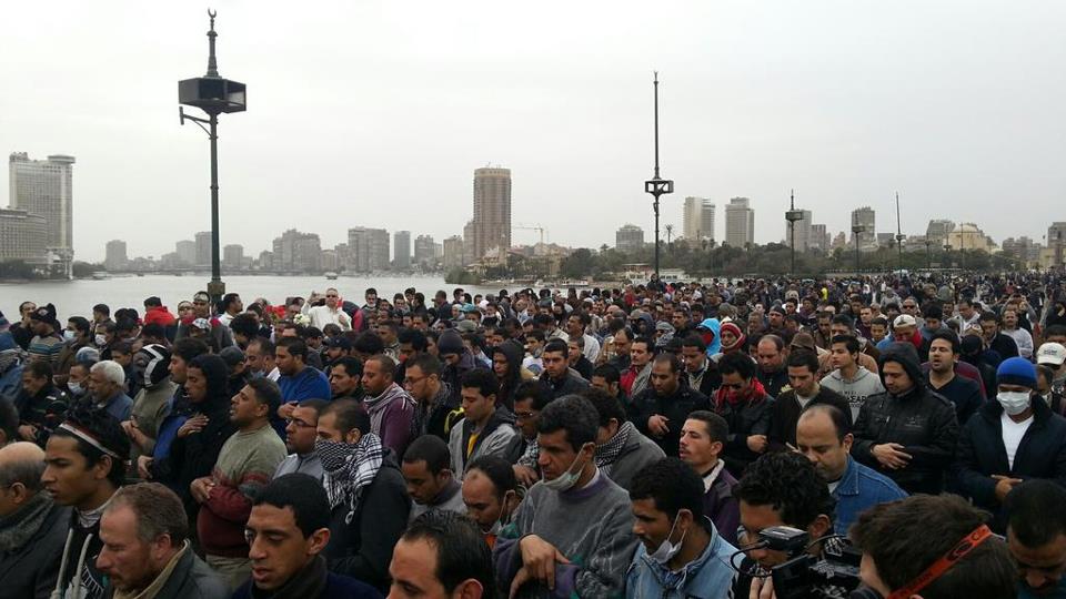 Protesters praying on Qasr Al Nil Bridge (near Tahrir Square) to mark January 28