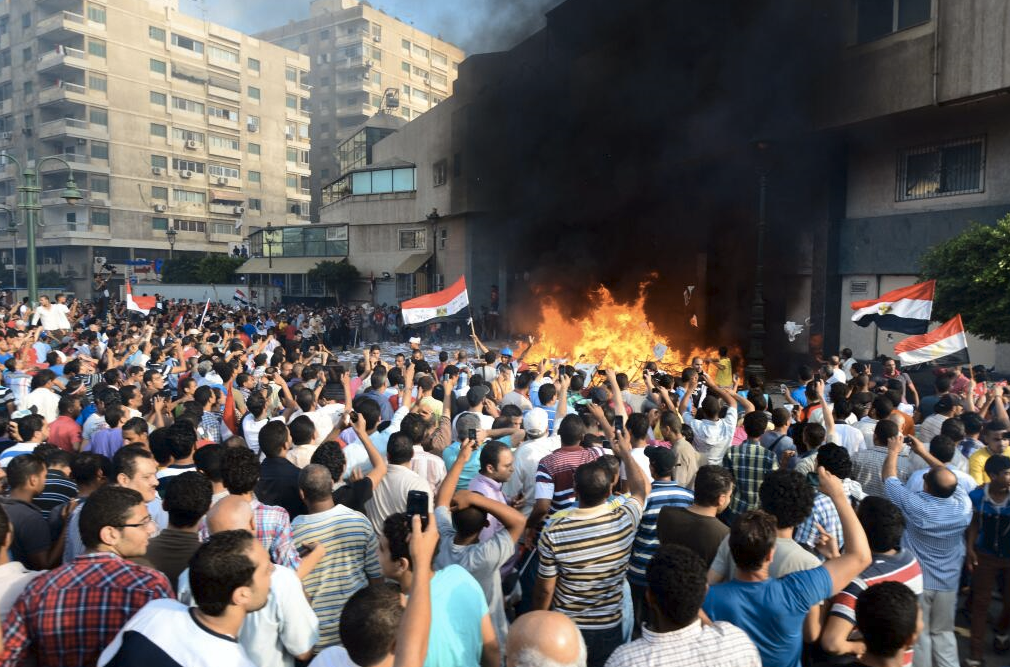 Protesters in Alexandria set fire to the Muslim Brotherhood's headquarters.