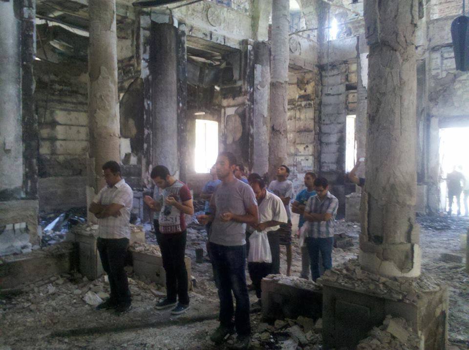 Coptic Pope Tawadros II shared this chilling image of Coptic Christians praying in a burned church