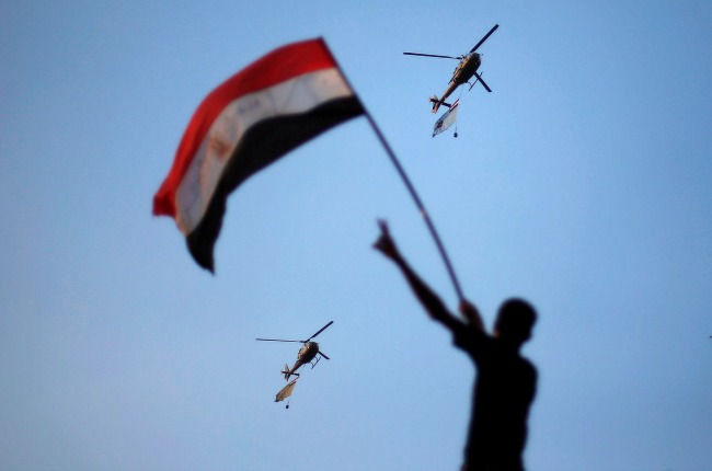 Military helicopters circle over Tahrir Square on July 1, 2013. (Credit: Suhaib Salem from Reuters)