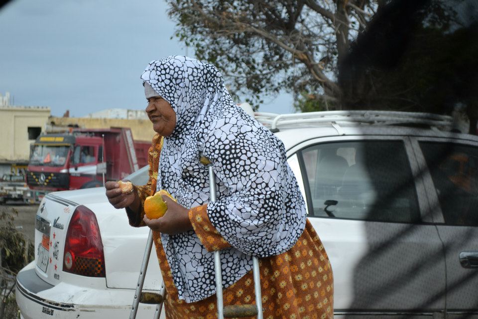 In the middle of flooded Alexandrian streets, this woman was returning to her orange stall