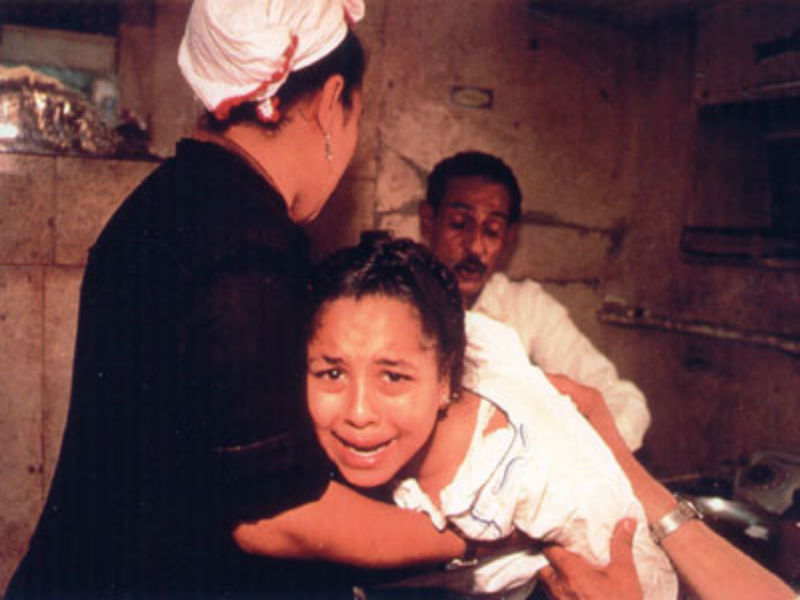 Famous photograph taken by a CNN reporter in the 1990s of female genital mutilation being performed in Egypt.
