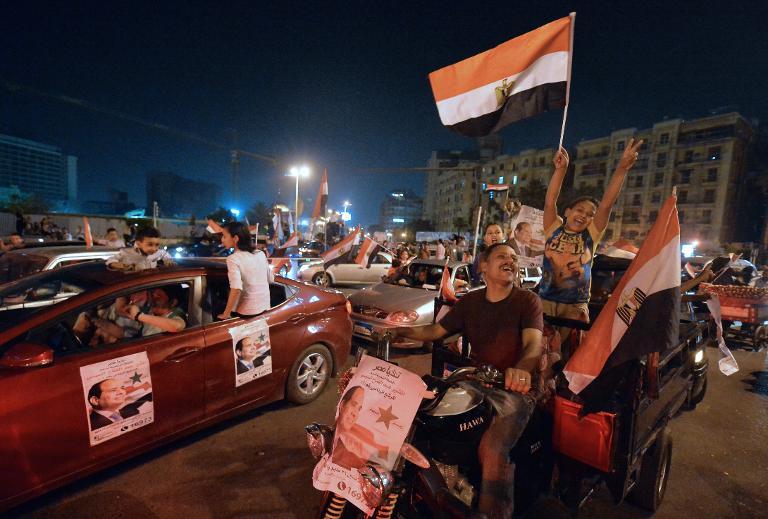 Supporters of Sisi celebrate at Tahrir Square after initial results on May 28, 2014. Credit: AFP