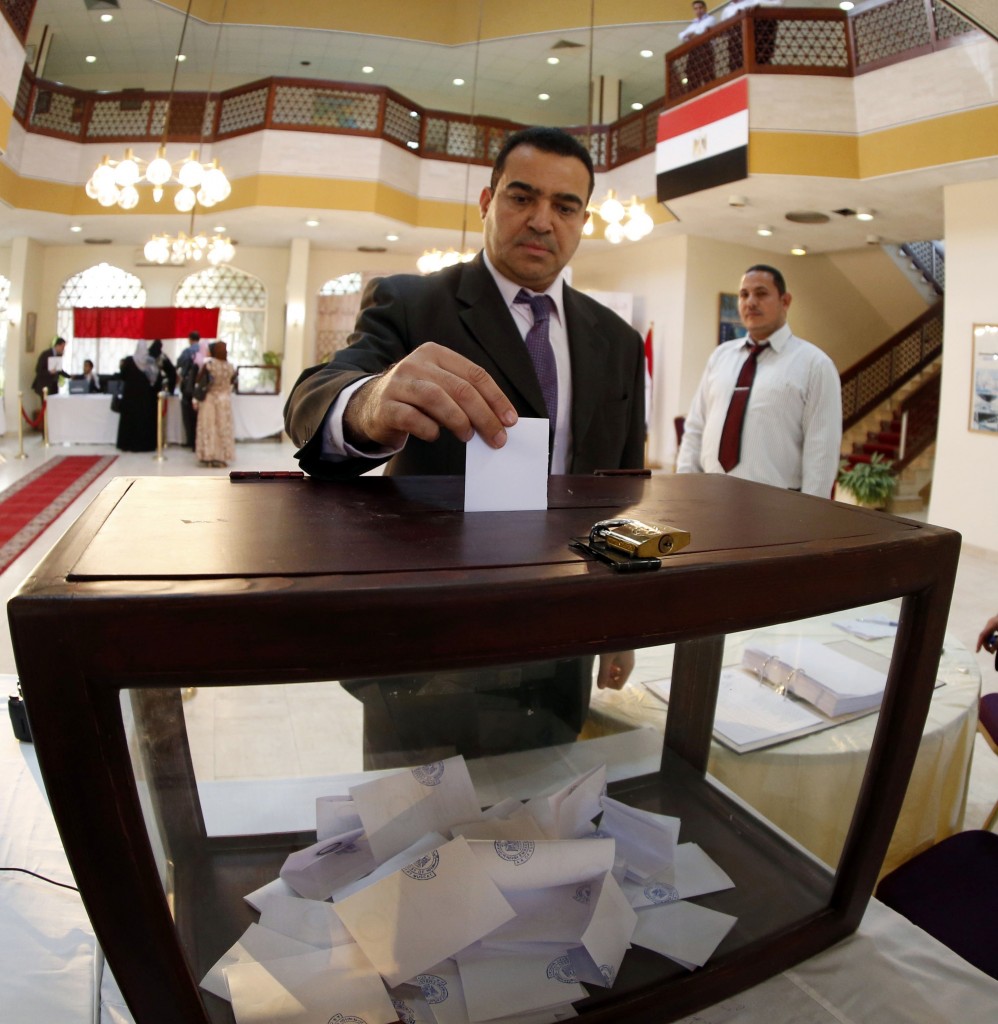 An Egyptian living in Oman casts his vote in January 2014 on Egypt's constitution.
