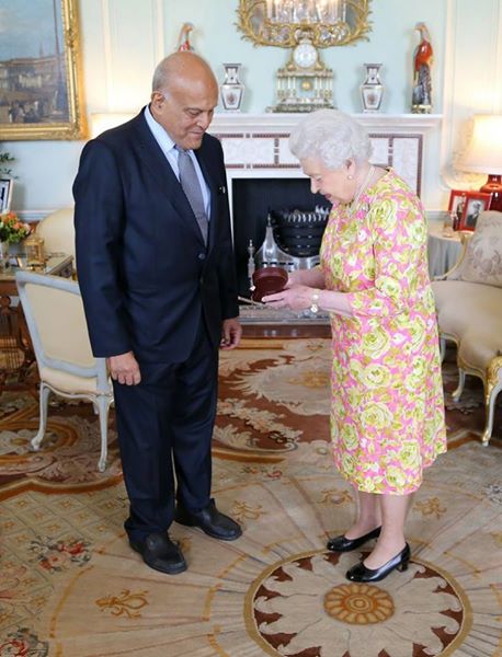 The Queen delivering the Order of the Merit to Professor Sir Magdi Yacoub.