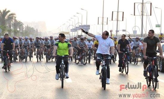 President Abdel Fattah Al-Sisi taking part in a cycling marathon earlier today.