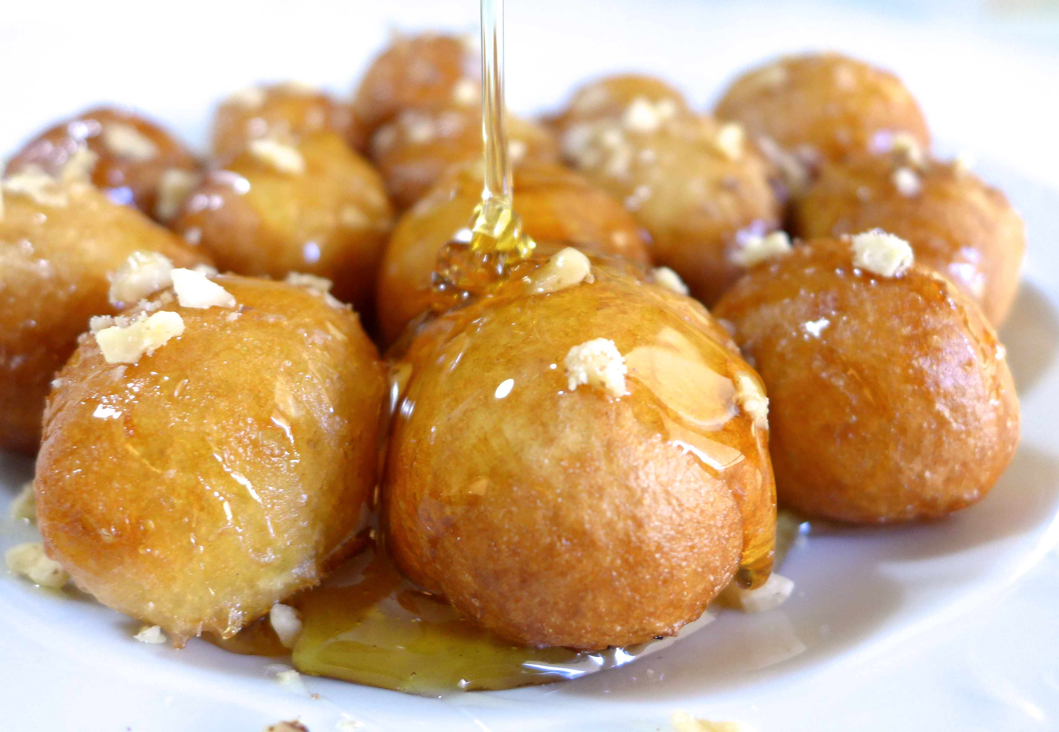 Loukoumades drizzled with honey. 