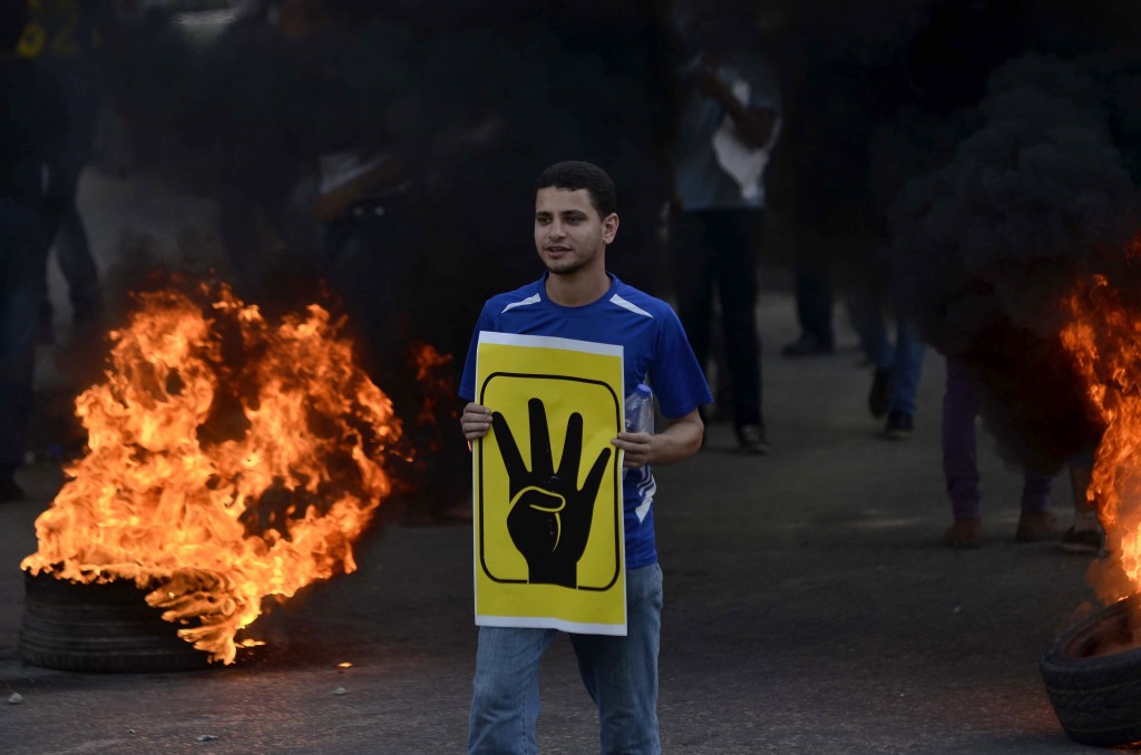 An Egyptian protester on August 2013 following the dispersal of thousands of Muslim Brotherhood and Morsi supporters. Credit: AFP