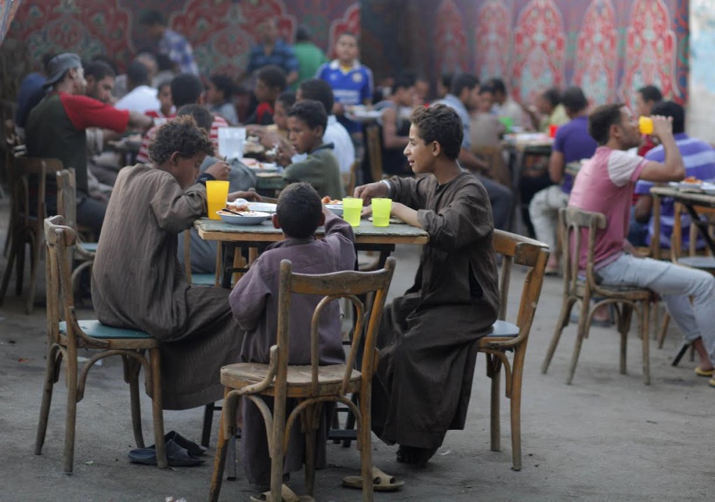 Egyptians  break their fast during a holy month of Ramadan  in Cairo, Egypt, Tuesday, July 24, 2012.  (AP Photo/Amr Nabil)