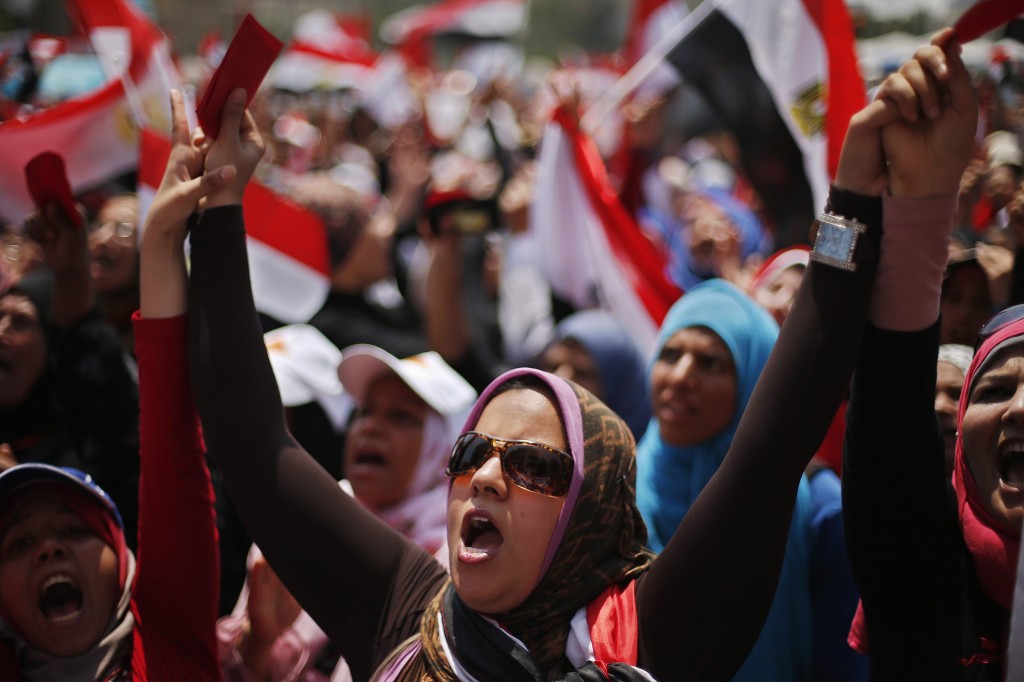Protesters opposing Egyptian President Mursi take part in protest demanding that he resign at Tahrir Square in Cairo