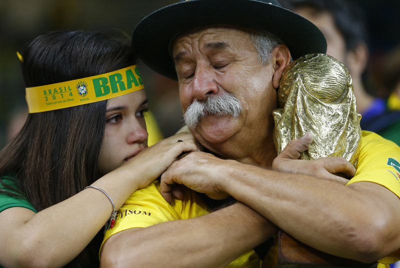 Fans react to Brazil's loss. Credit: REUTERS/Damir Sagolj
