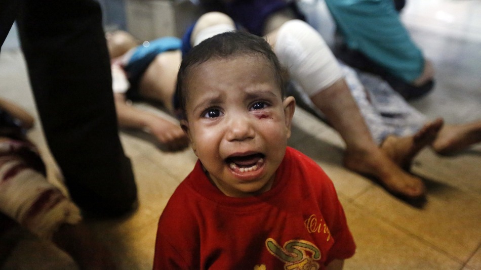 A Palestinian child, wounded in an Israeli strike on a compound housing a U.N. school in Beit Hanoun, in the northern Gaza Strip, cries at the emergency room of the Kamal Adwan hospital in Beit Lahiya, Thursday, July 24, 2014. Credit: LEFTERIS PITARAKIS/ASSOCIATED PRESS