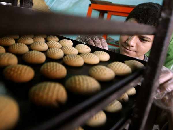 Kahk after baking on a cooling rack, before getting sprinkled with sugar and honey. Photograph by Kahled Desouki, AFP/Getty Images