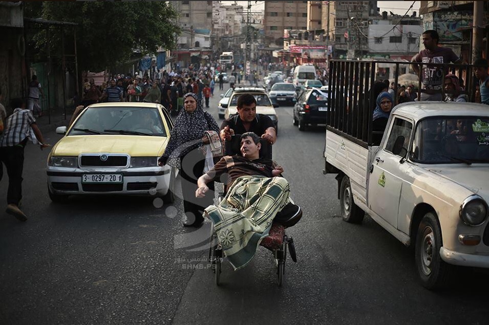 Palestinians fleeing what authorities have called a 'massacre' in Al-Shijaeya.