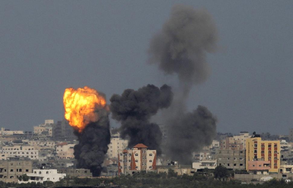 An explosion is seen on Sunday in the northern Gaza Strip after an Israeli air strike Photo: AMMAR AWAD/REUTERS