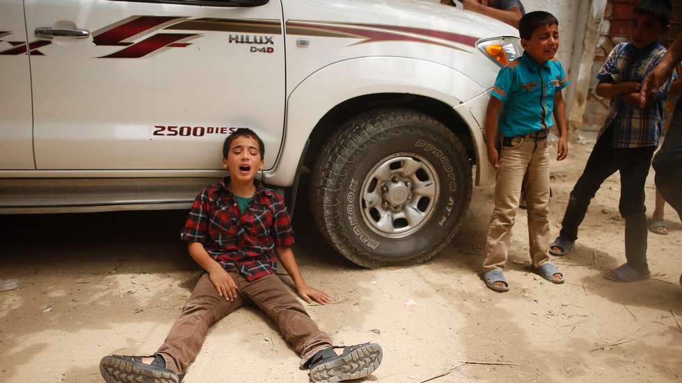 A boy mourns after the funeral for relatives of the Gaza police chief Tayseer al-Batsh, who officials said were killed in an Israeli air strike. Photo: Mohammed Salem/Reuters