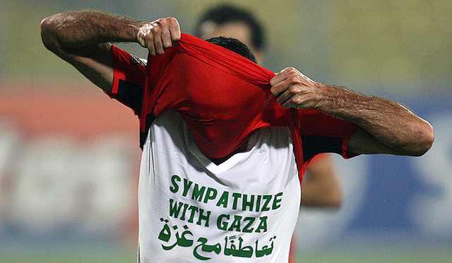 Egyptian Soccer Star Abou Treika wearing a T-shirt that reads "Sympathize with Gaza," during An African Cup of Nations match.