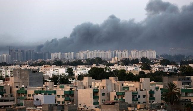 Smoke billows over Tripoli during fighting in July 2014.