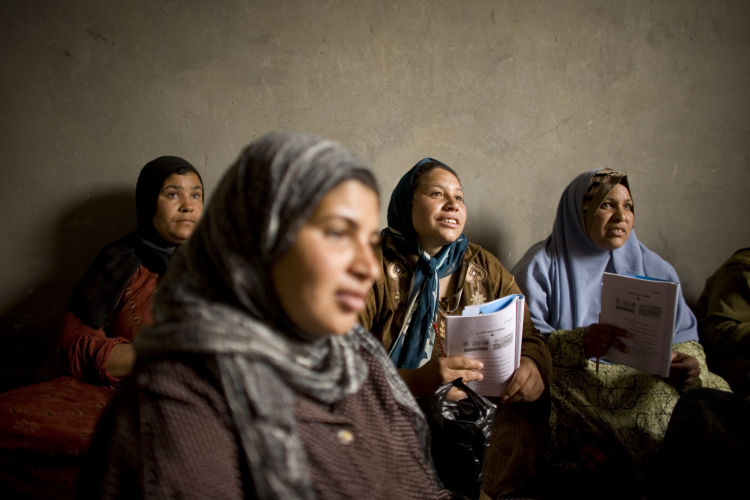 Women attending an illiteracy class. Photo: Laura Boushnak. 