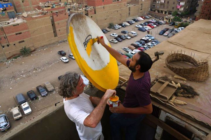 Stoneking starts his project by painting dishes on the art space’s roof (Photo by Giacomo Crescenzi)