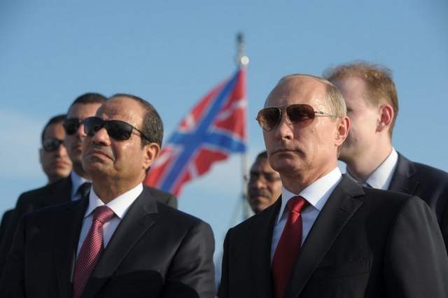 Russian President Vladimir Putin, right, and Egyptian President Abdel Fattah el-Sisi visit the Black Sea Fleet's missile cruiser Moskva on Aug. 12 in the sea port of Sochi. (Alexei Druzhinin / AFP)