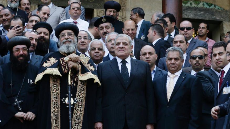 Coptic Pope Tawadros II and Egypt's Prime Minister Mehleb attend the opening ceremony