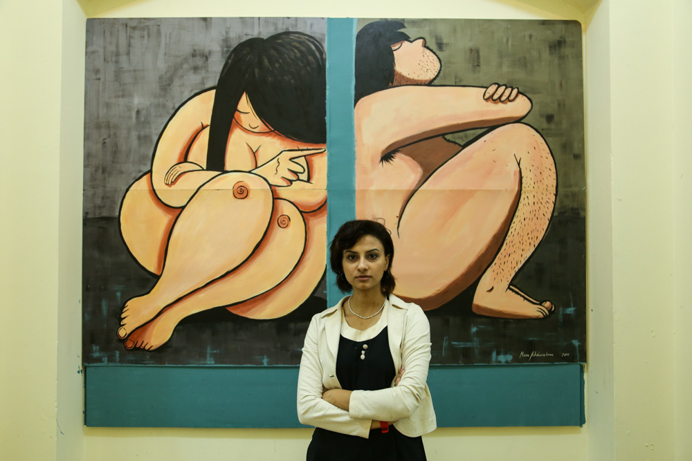 One of the artists and her work at the exhibition.