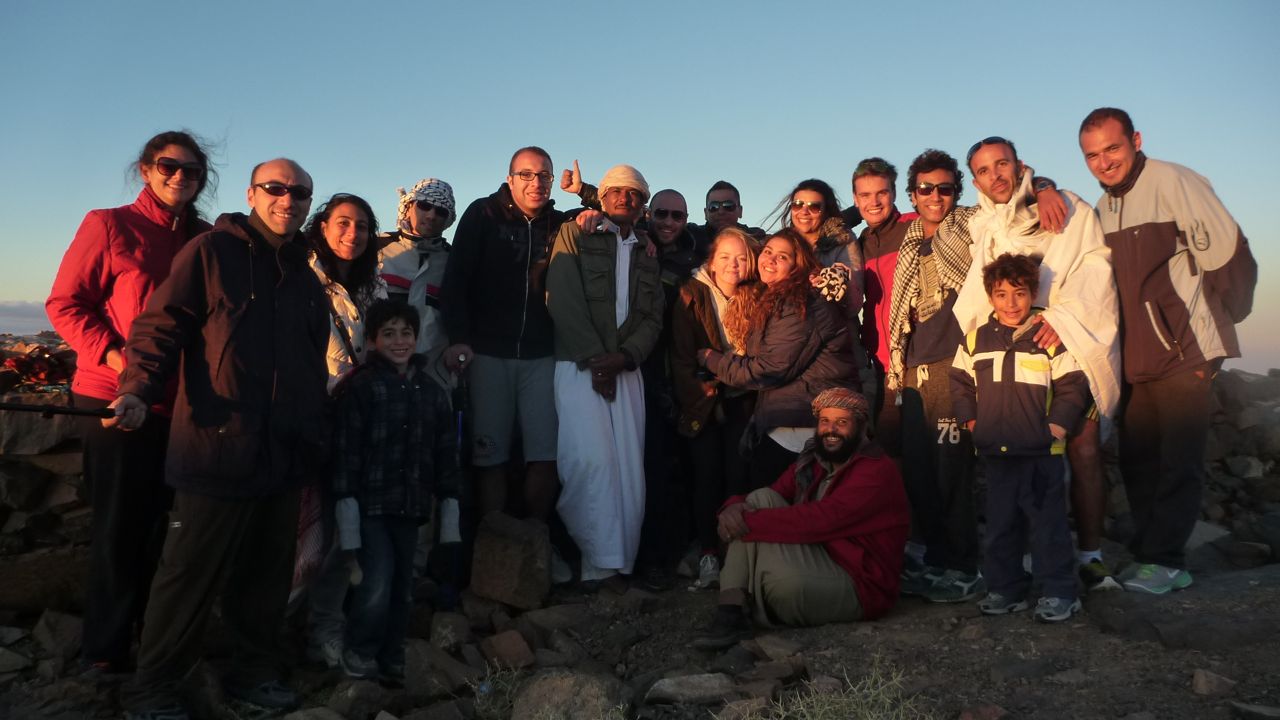 Nasr Mansour, the chief Bedouin guide, surrounded by hikers on Jebel Abbas Basha