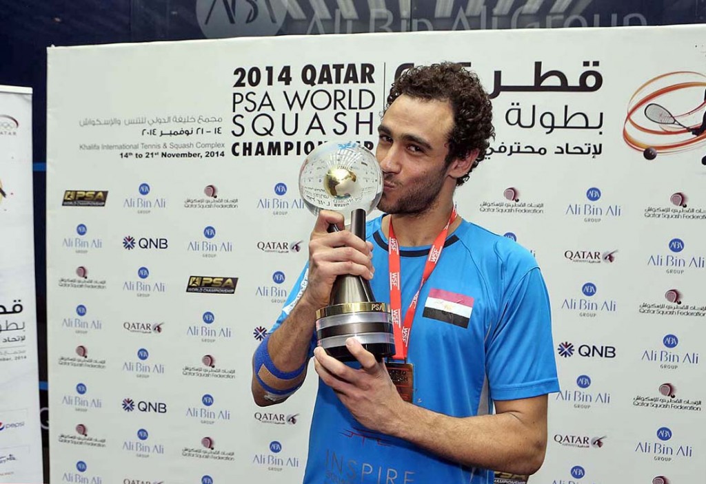 The 2014 world champion Ramy Ashour kisses the trophy