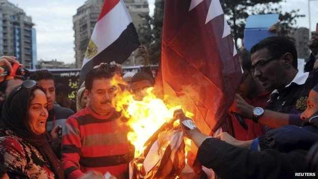 Protesters burn Qatari flag in Cairo earlier this year.
