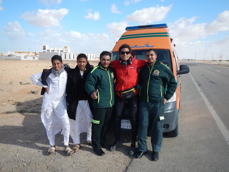 This ambulance car decided to stop when it bumped into my way to Saloum. They knew that I was the guy who is touring around Egypt by bike, and they decided to take a picture with me.