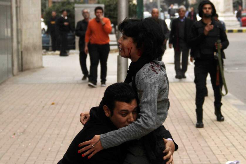 SPAP activist Sabbagh receives help after she was shot during a protest by the party in Cairo