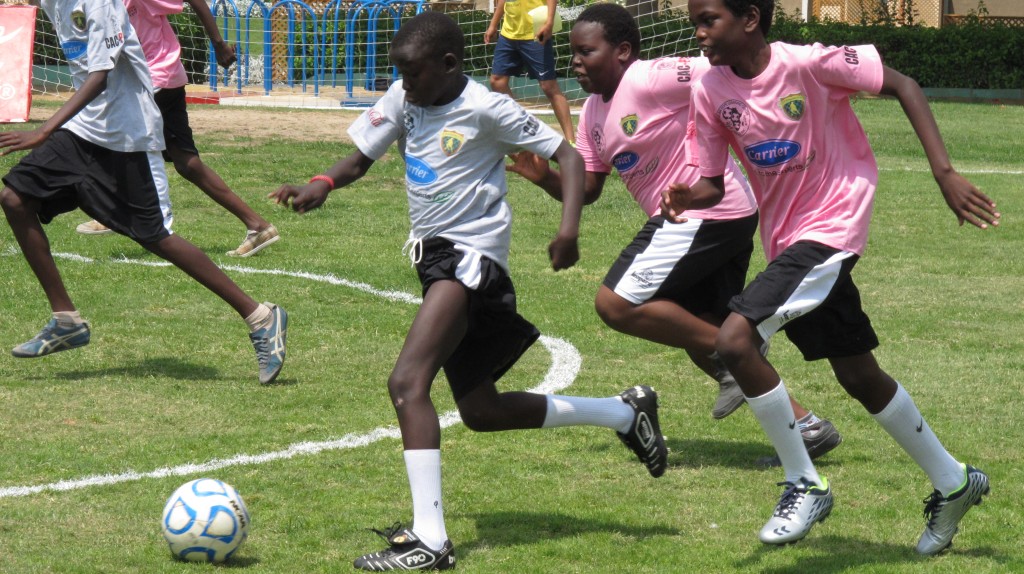 African refugees in a soccer match from last year's EIS event. [Courtesy of EIS]