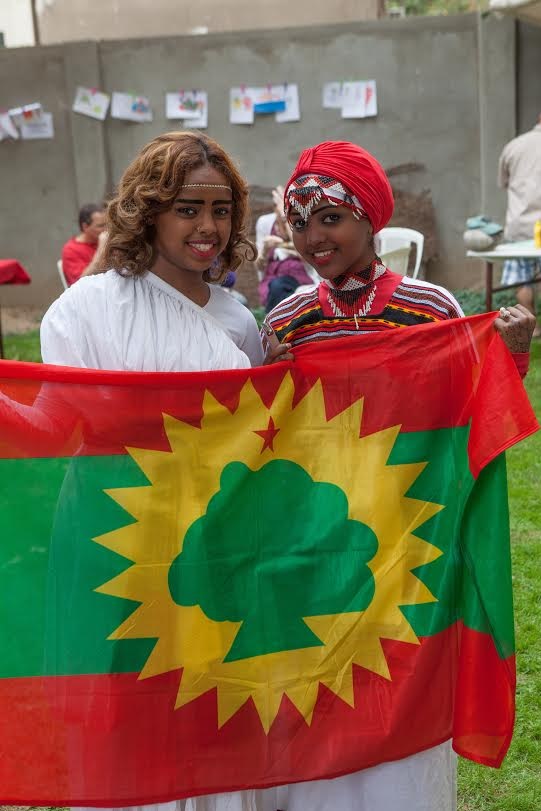 Students of AHLC wearing traditional Eritrean attire, posing with their national flag. As part of the festivities, these girls donned traditional clothing to accompany their dance performances. Fair goers could enjoy traditional Eritrean tsebhi (stew) served with injera (a type of flatbread) along with many other varieties of African cuisine.