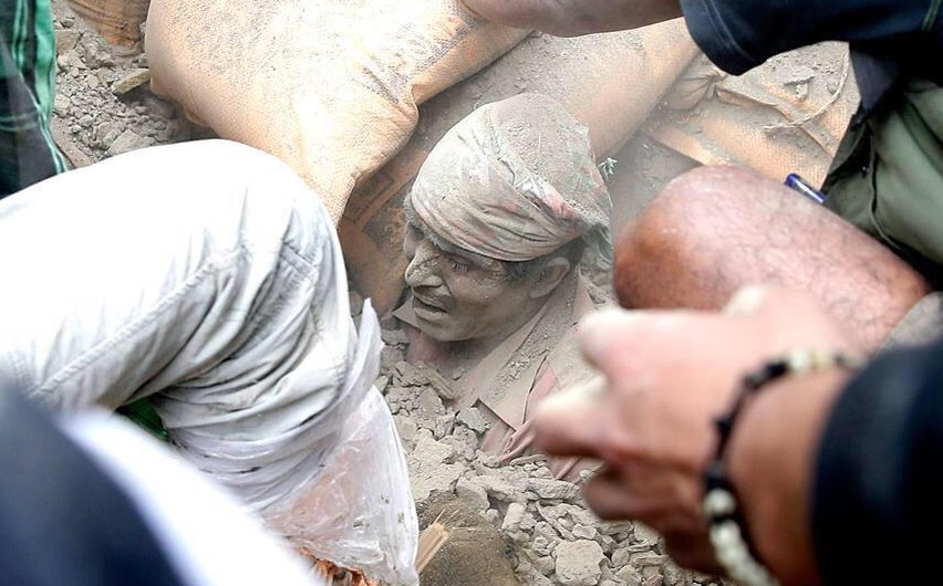 Man being pulled from the rubble in Nepal. Credit: unknown
