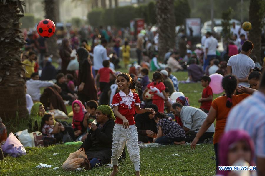 Egyptian families celebrate Sham El-Nessim in 2013 at a park in Cairo. Credit: Amru Salahuddien