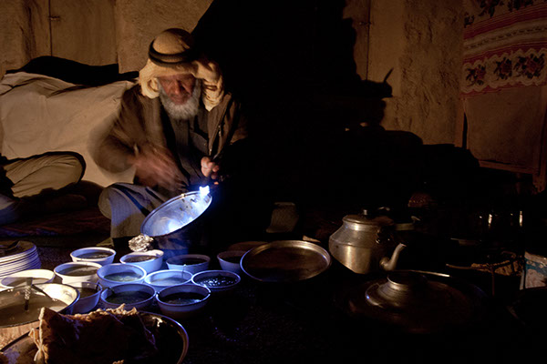Dr. Ahmad, a renowned veteran of herbology in Sinai, preparing dinner for a number of guests