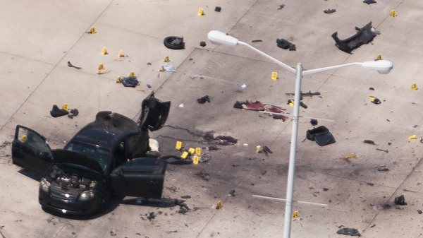 The car that was used the previous night by two gunmen is investigated by local police and the FBI in Garland. (Reuters/Rex Curry)