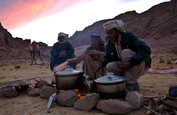 Tribesmen in St. Catherine, Sinai, cooking dinner on the way up to Mount Sinai. Credit: Enas El Masry