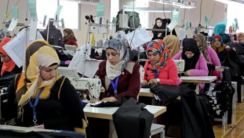 Jordanian women sewing jeans in a garmet factory in the village of Kitteh in northern Jordan. Credit: Raad Adayleh/AP