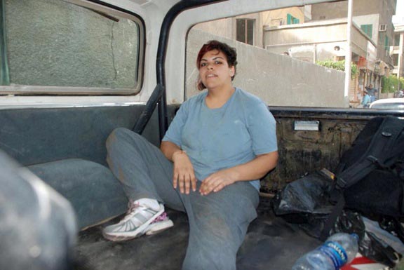 Lara relaxing at the back of her truck upon cleaning it up
