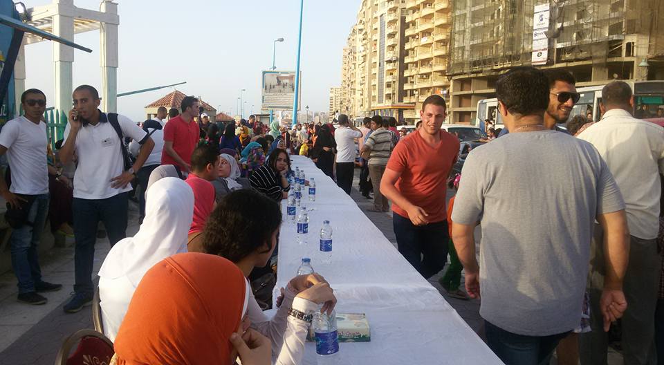 People patiently waiting at the iftar table before sunset. Credit: Nesma Elgohary