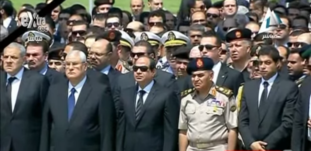 President Abdel Fattah al-Sisi and top Egyptian figures march in a brief military funeral honoring General Prosecutor Hisham Barakat