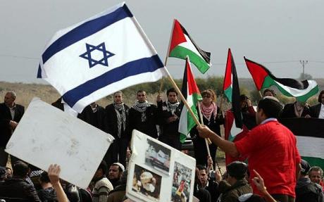 An Israeli activist waves his national flag at Israeli Arab demonstrators waving Palestinian flags. Credit: AFP