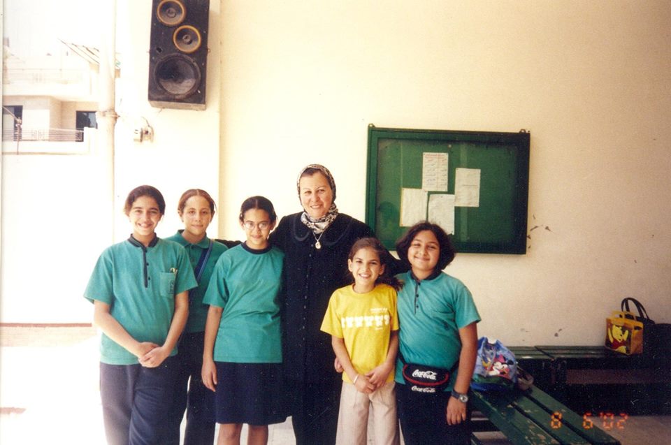 My fifth grade school friends and I posing for a picture with the principle