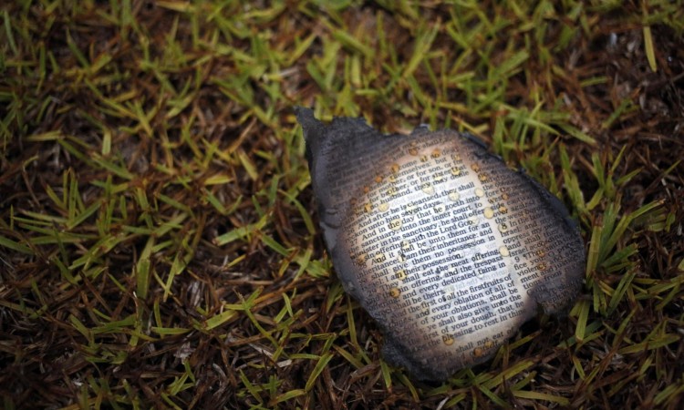A charred bible page outside Mount Zion African Methodist Episcopal church on Wednesday in Greeleyville, South Carolina. Credit: Veasey Conway/AP