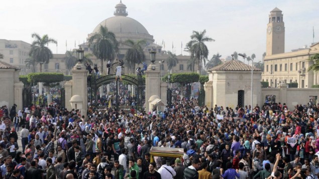 Student protesters gather outside the main gate of Cairo University, Cairo, Egypt Sunday, Dec. 1, 2013 before marching to Tahrir square. Credit: AP/Mohammed Asad