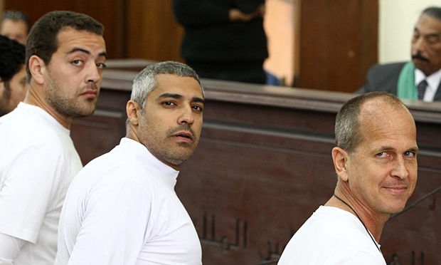 Peter Grest (right) along with Mohamed Fahmy (center) and Baher Mohamed (left) during their first trial in 2014.