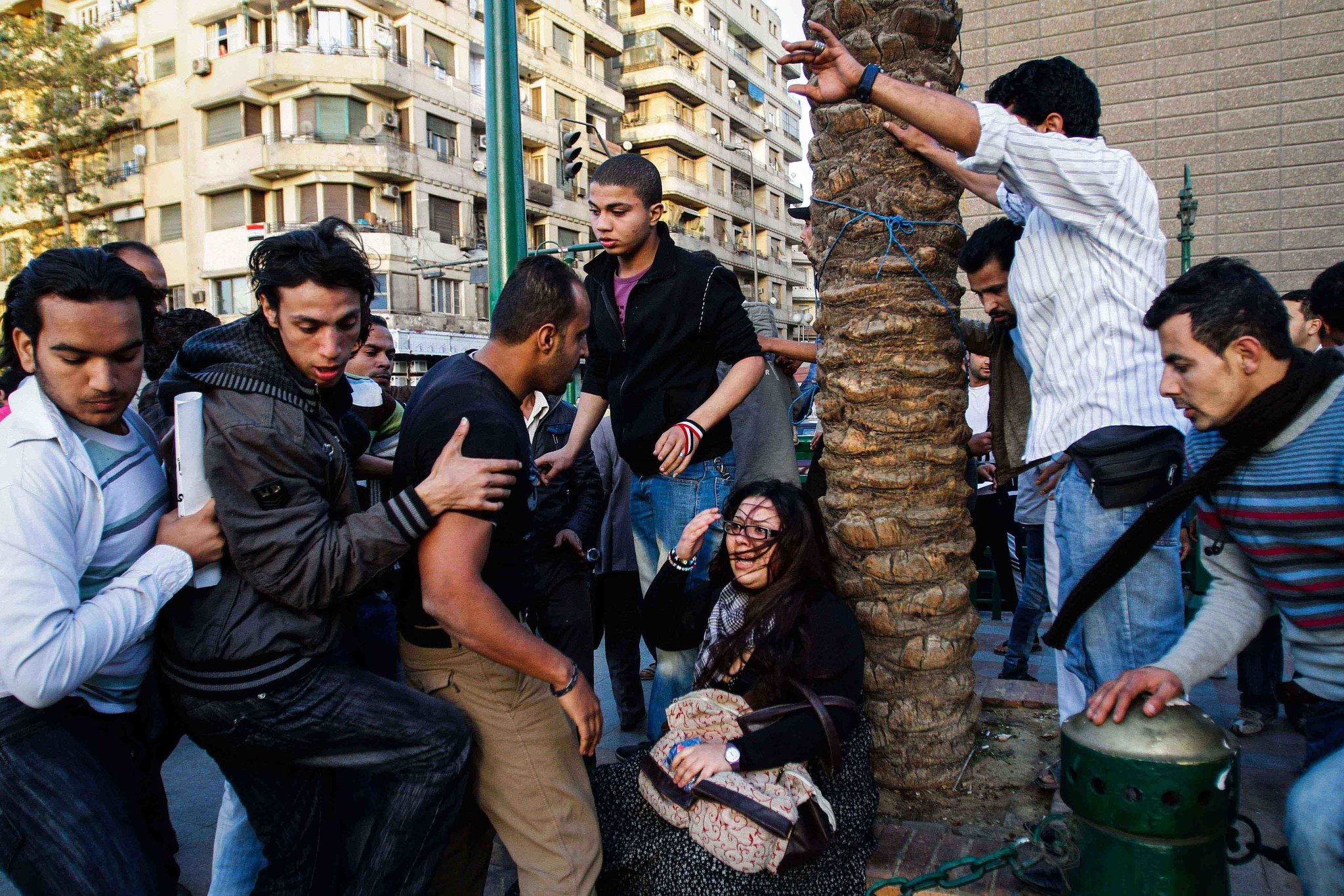 An Egyptian woman was assaulted by several men in Tahrir Square during a march for International Women's Day in March 2011. Credit: Eman Helal
